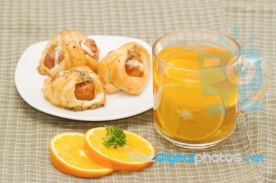 Tea Break, Orange Tea With Little  Croissant Stock Photo