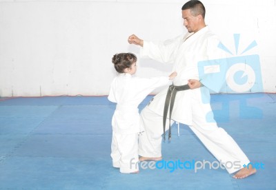 Teacher Training Karate To A Little Girl Stock Photo Teacher Training Karate To A Little Girl Stock Photo