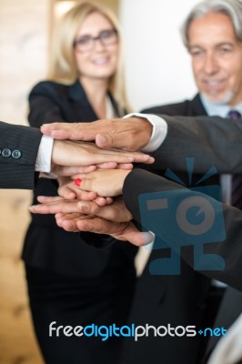 Teamwork - Business People With Joint Hands In The Office Stock Photo