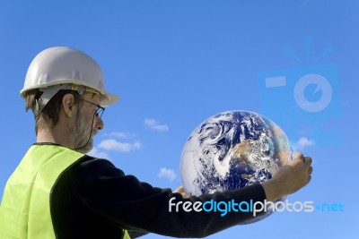 Technician Holding The Earth Stock Photo