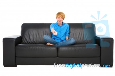 Teenage Boy Holding Tv Remote Stock Photo