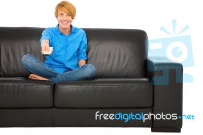 Teenage Boy Holding Tv Remote Stock Photo