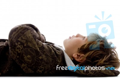Teenage Boy Lying On Floor Stock Photo
