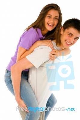 Teenage Boy Piggybacking Girl Stock Photo