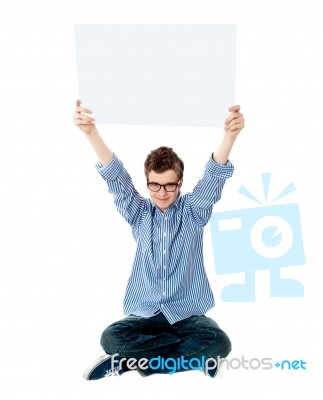teenage Boy Showing Empty board Stock Photo
