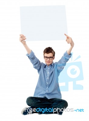 teenage Boy Showing Empty board Stock Photo