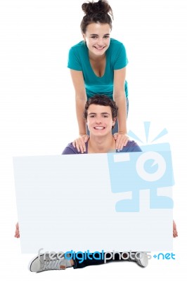 Teenage Couples Holding Blank Board Stock Photo