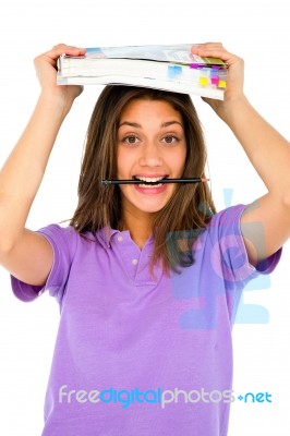 Teenage Girl Biting Pencil Stock Photo