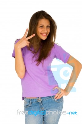 Teenage Girl Giving Peace Sign Stock Photo