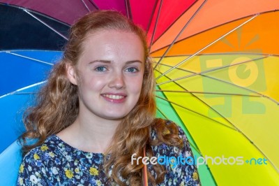 Teenage Girl Holding Colorful Umbrella Stock Photo