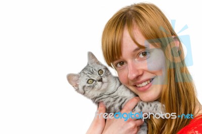 Teenage Girl Hugging Young Tabby Cat Stock Photo