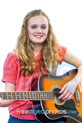 Teenage Girl Playing Guitar Stock Photo