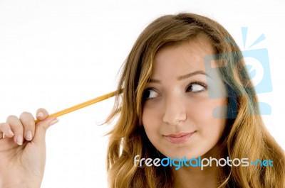 Teenage Girl Thinking With Pencil Stock Photo