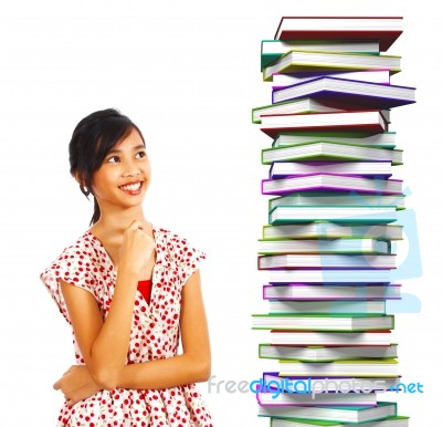 Teenage Student With Stacked Books Stock Photo