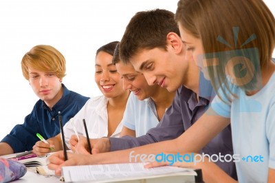 Teenage student Writing On book Stock Photo