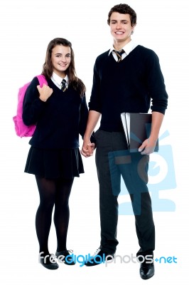 Teenage Students Holding Hands Stock Photo