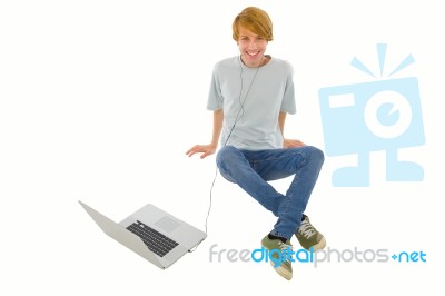 Teenager Listening Music With PC Stock Photo