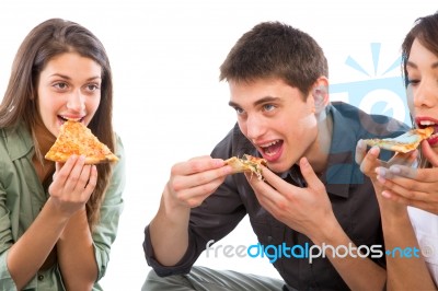 Teenagers Eating Pizza Stock Photo