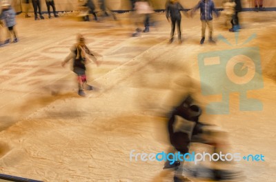 Teenagers Skating On The Ice Rink Stock Photo