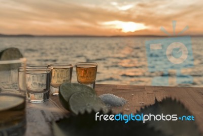 Tequila By The Sea At Sunset Stock Photo
