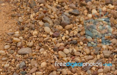 Textured Background Of Stones And River Sand Stock Photo