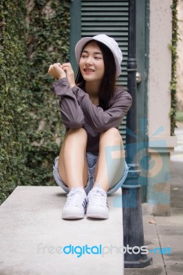 Thai Adult Girl White Cap Gray T-shirt Beautiful Girl Relax And Smile Stock Photo Thai Adult Girl White Cap Gray T-shirt Beautiful Girl Relax And Smile Stock Photo