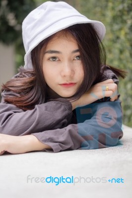 Thai Adult Girl White Cap Gray T-shirt Beautiful Girl Relax And Smile Stock Photo