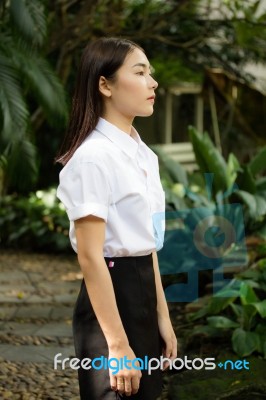 Thai Adult Student University Uniform Beautiful Girl Relax And Smile Stock Photo