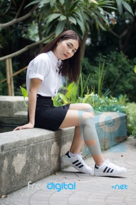 Thai Adult Student University Uniform Beautiful Girl Relax And Smile Stock Photo