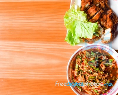 Thai Food (kaiyang-somtum) : Panaya Spicy Salad With Salted Crab And Grilled Chicken And Sticky Rice In Wicker Basket On Wooden Background,yummy Authentic Local Thai Food Somtum And Gaiyang, Papaya Spicy Salad And Griled Chicken With Purple Orchid Stock Photo
