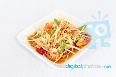 Thai Food Papaya Salad On White Dish Stock Photo