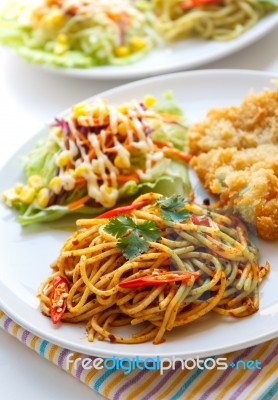 Thai Red Curry  Spaghetti With Fried Fish Stock Photo