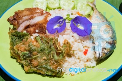 Thai Traditional Spicy Fried Rice With Chili Paste,fried  Mackerel,crispy Pork  And Local Vegetable Stock Photo
