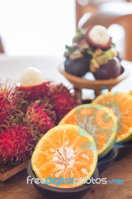 Thai Tropical Fruit On Wooden Table Stock Photo