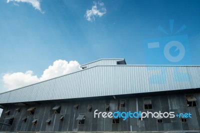 Thai Zinc Barn Against Blue Sky Stock Photo