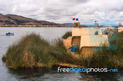 Thatched Home On Floating Islands On Lake Titicaca, Puno, Peru, Stock Photo