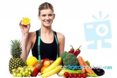 The Beautiful Girl With Fruits And Vegetables Stock Photo