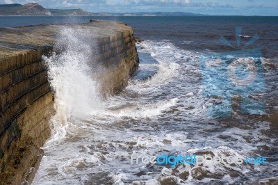 The Cobb Harbour Wall In Lyme Regis Stock Photo