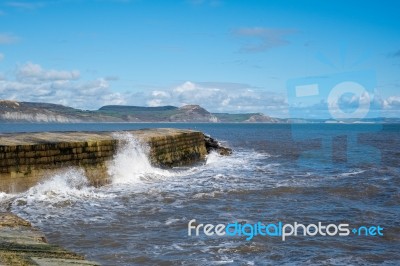 The Cobb Harbour Wall In Lyme Regis Stock Photo