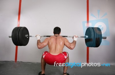 The Concept Of Power And Determination Of A Man Lifting A Weight… Stock Photo