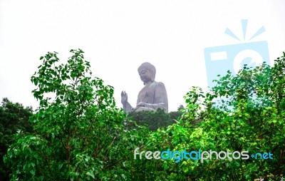 The Enormous Tian Tan Buddha Statue At High Mountain Near Po Lin Monastery, Lantau Island, Hong Kong Stock Photo