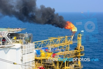 The Gas Flare Is On The Offshore Oil Rig Stock Photo