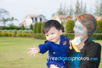 The Grandson With The Grandparents Stock Photo