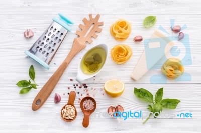 The Ingredients For Homemade Pesto Pasta On White Wooden Backgro… Stock Photo