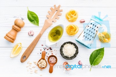 The Ingredients For Homemade Pesto Pasta On White Wooden Backgro… Stock Photo