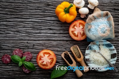 The Ingredients For Homemade Pizza On Shabby Wooden Background Stock Photo