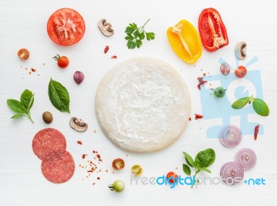 The Ingredients For Homemade Pizza On White Wooden Background Stock Photo