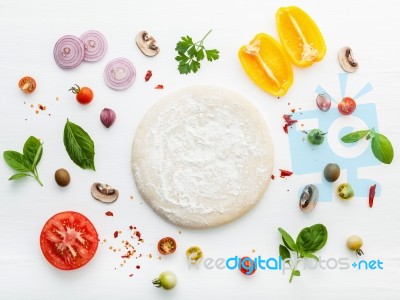 The Ingredients For Homemade Pizza On White Wooden Background Stock Photo