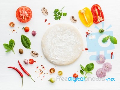 The Ingredients For Homemade Pizza On White Wooden Background Stock Photo