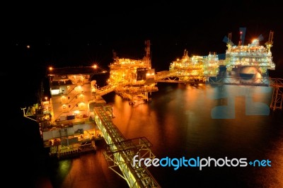 The Large Offshore Oil Rig At Night Stock Photo The Large Offshore Oil Rig At Night Stock Photo